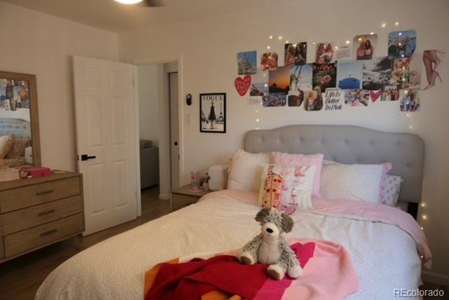 830 20th Street, Unit 303 Boulder, CO 80302 - Photo 10 of 28 a bedroom with a bed and a mirror