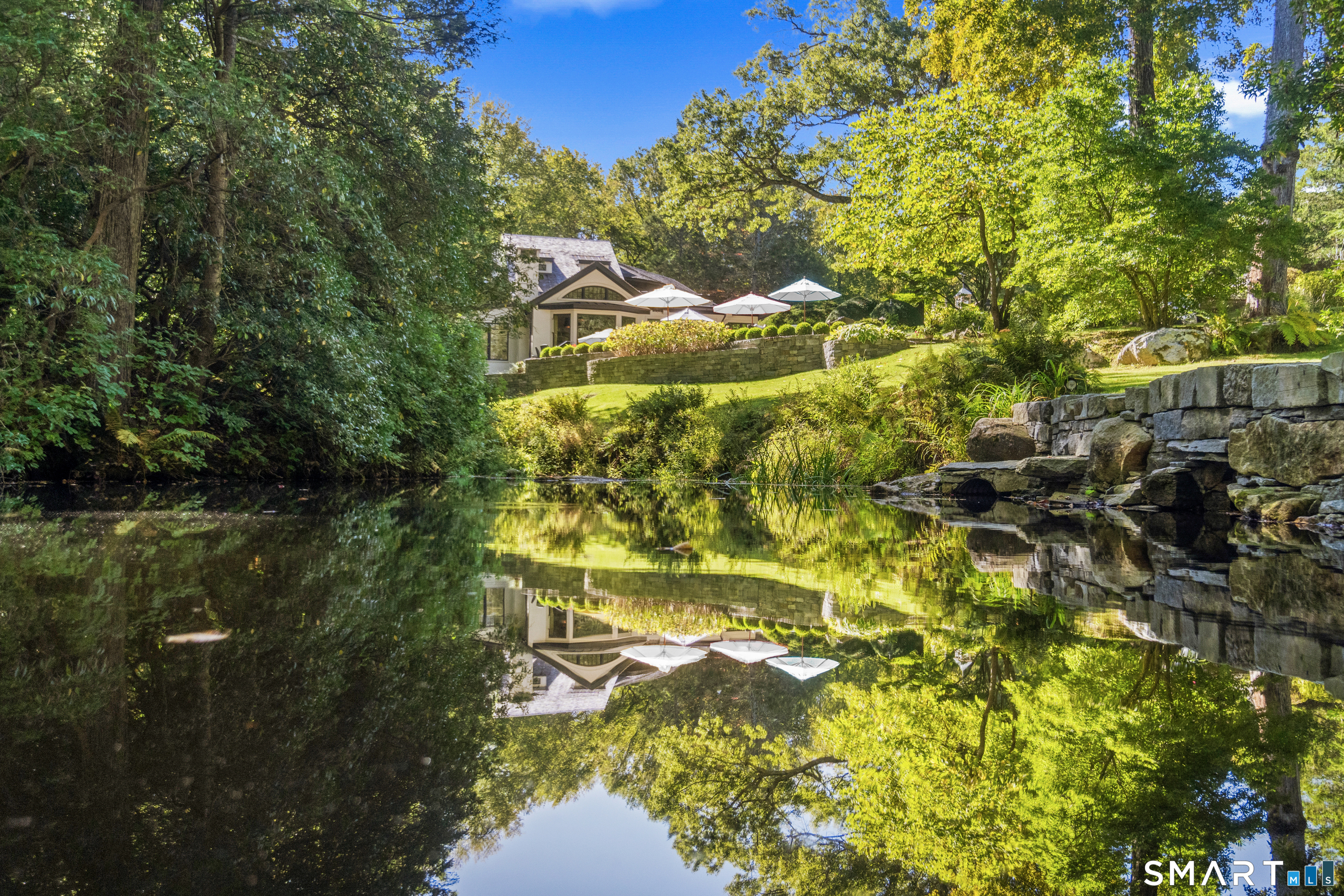 252 River Road Deep River, CT 06417 - Photo 4 of 40 Sounds of a babbling brook & tranquil views overlooking a serene pond setting.