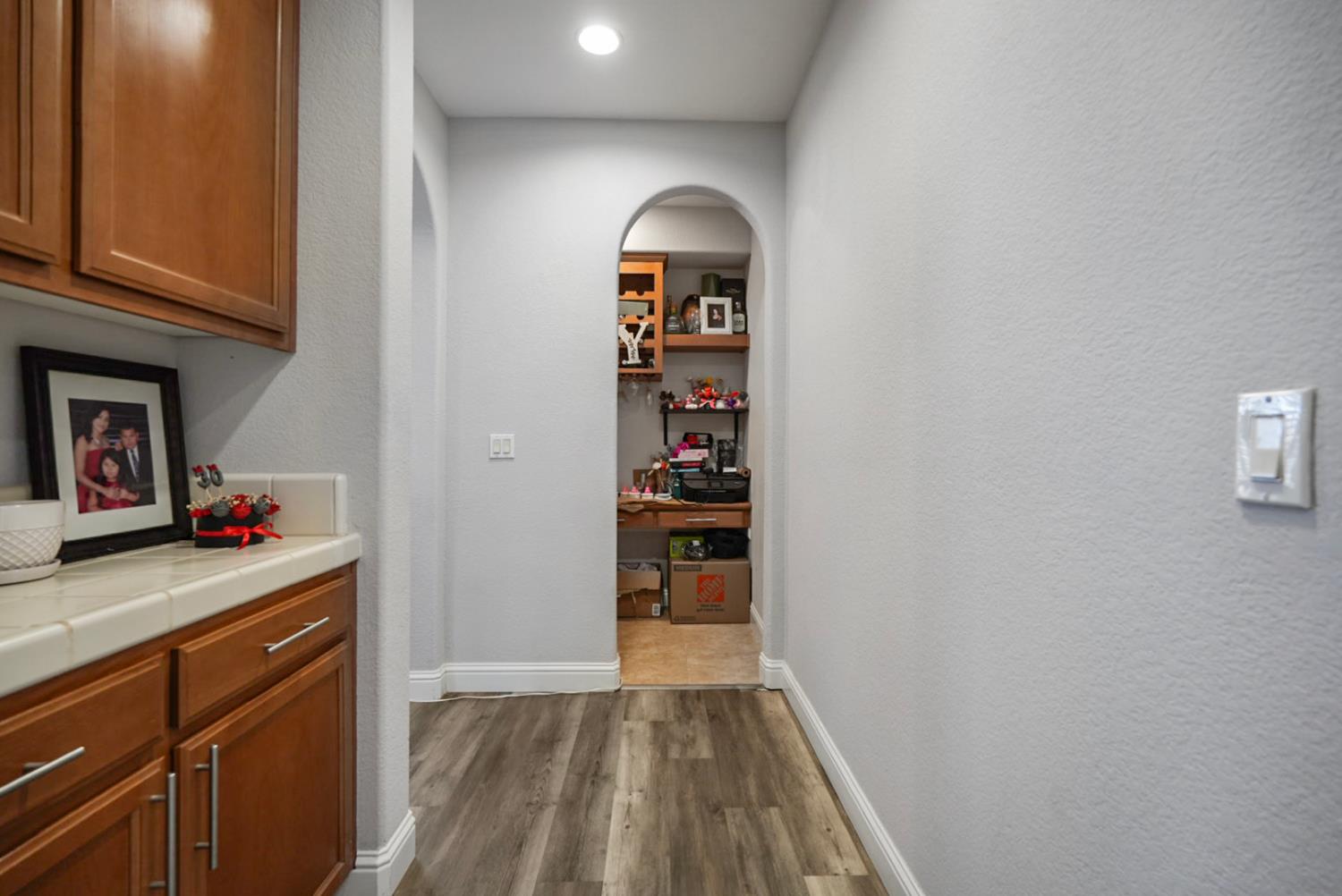16501 Upper Pasture Lathrop, CA 95330 - Photo 11 of 41 a view of a kitchen with fridge and rack
