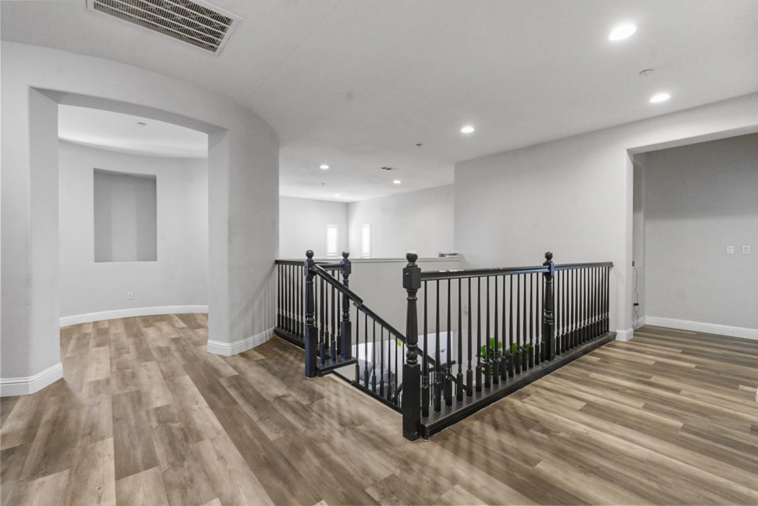 16501 Upper Pasture Lathrop, CA 95330 - Photo 18 of 41 a view of a hallway with wooden floor