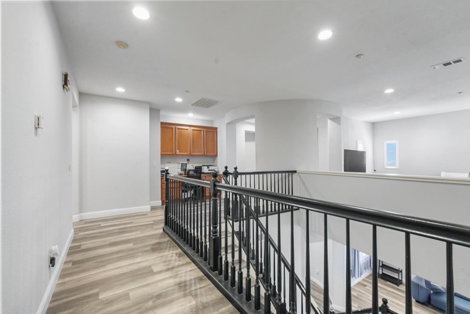 16501 Upper Pasture Lathrop, CA 95330 - Photo 19 of 41 a view of a hallway with wooden floor