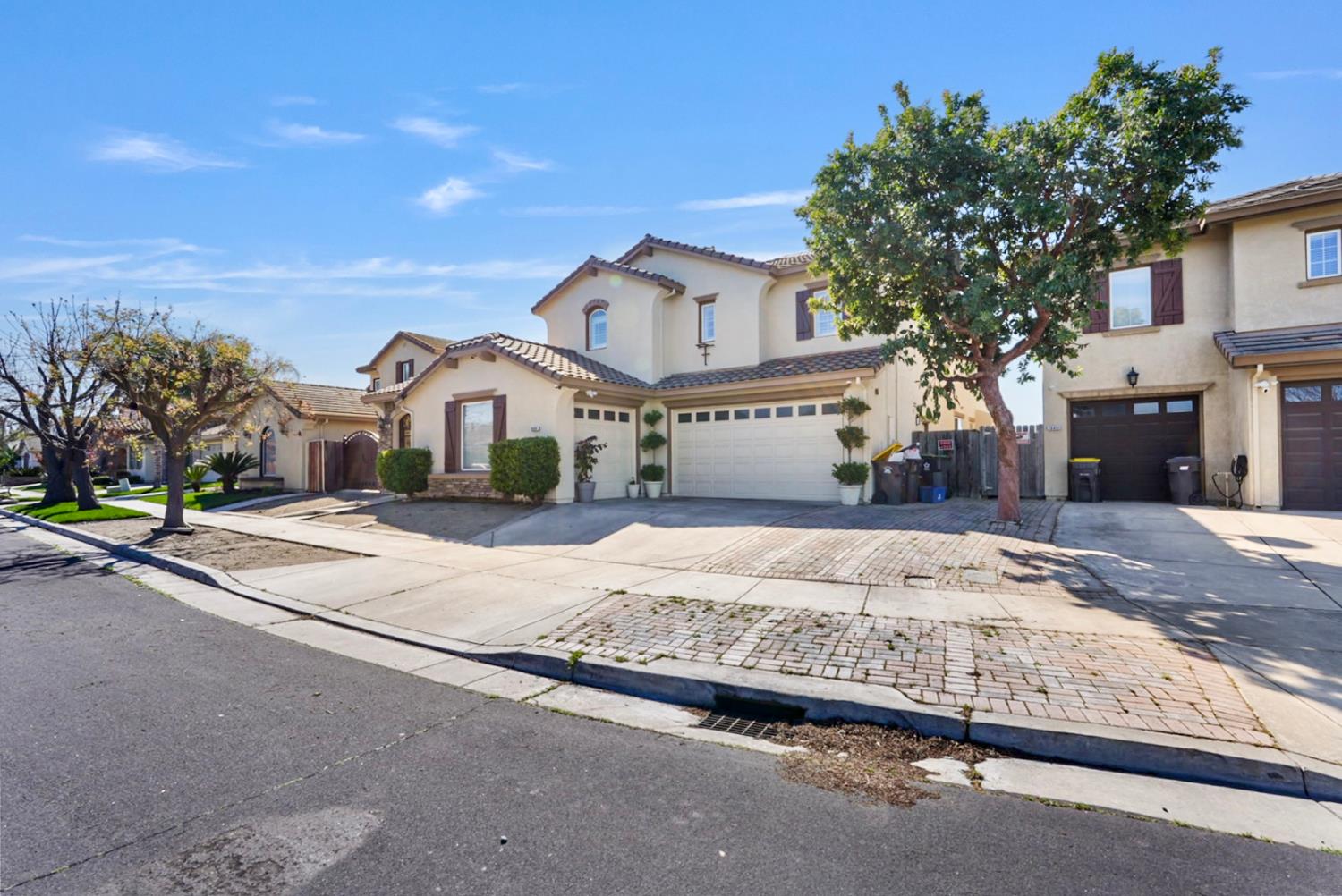 16501 Upper Pasture Lathrop, CA 95330 - Photo 2 of 41 a front view of a house with a yard and garage
