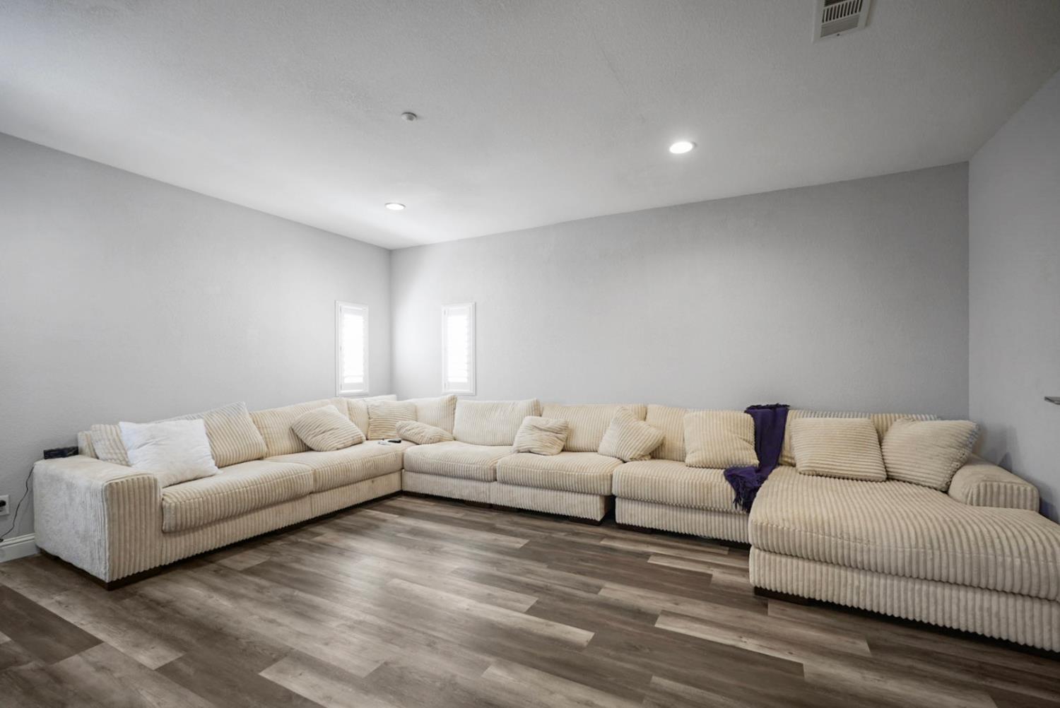 16501 Upper Pasture Lathrop, CA 95330 - Photo 21 of 41 a living room with furniture and white walls