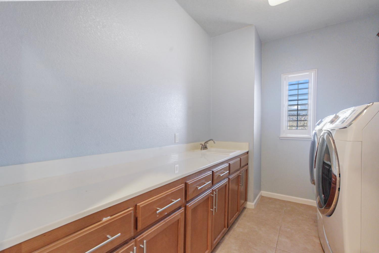 16501 Upper Pasture Lathrop, CA 95330 - Photo 22 of 41 a utility room with dryer and washer