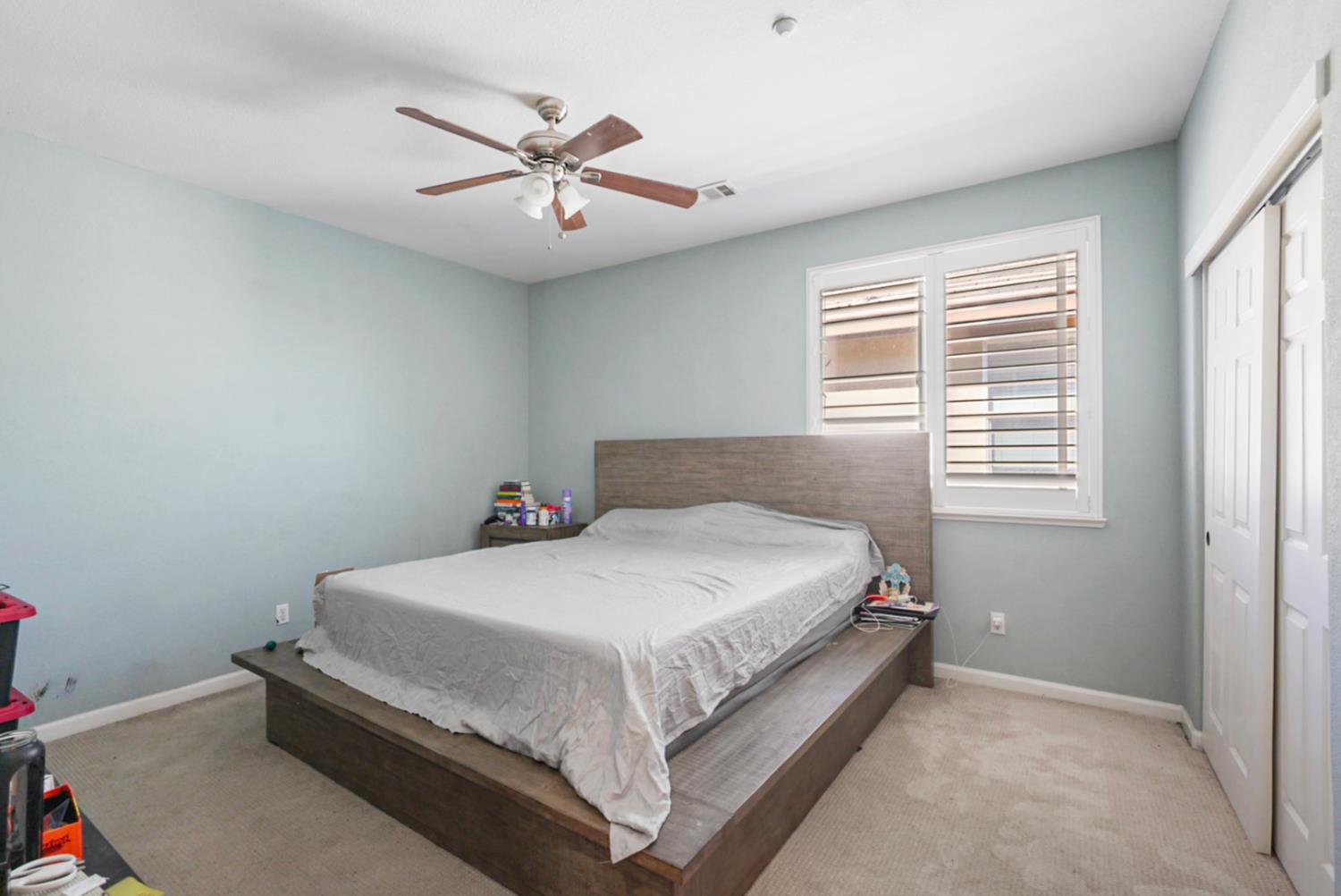 16501 Upper Pasture Lathrop, CA 95330 - Photo 24 of 41 a bedroom with a bed and window