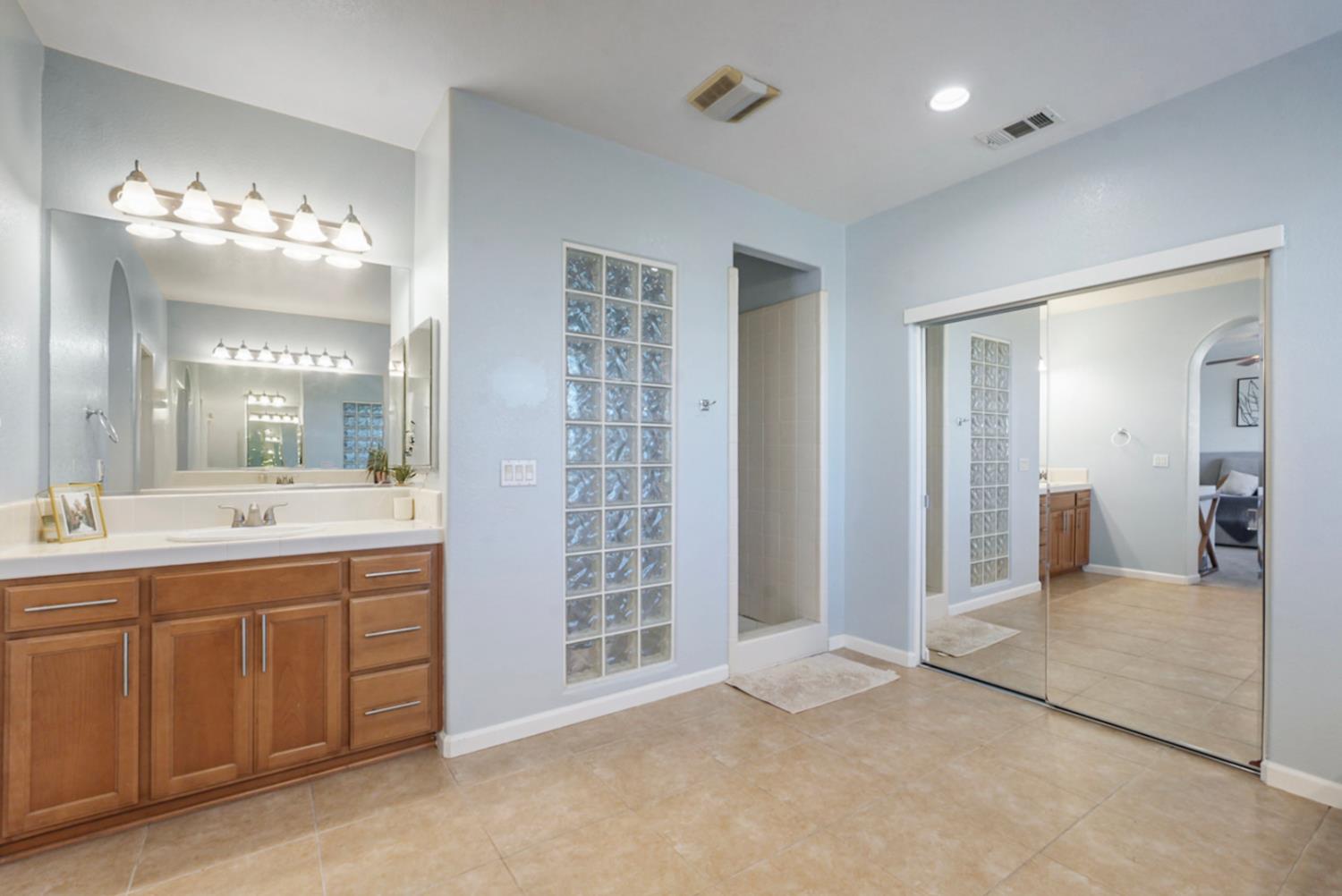 16501 Upper Pasture Lathrop, CA 95330 - Photo 28 of 41 a bathroom with a double vanity sink mirror and double