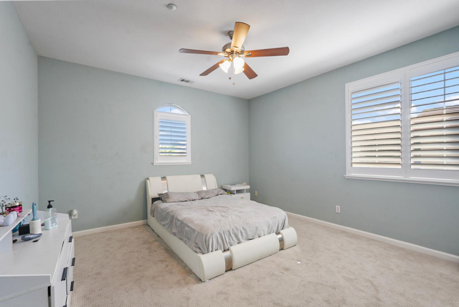 16501 Upper Pasture Lathrop, CA 95330 - Photo 29 of 41 a bedroom with a large bed and a window