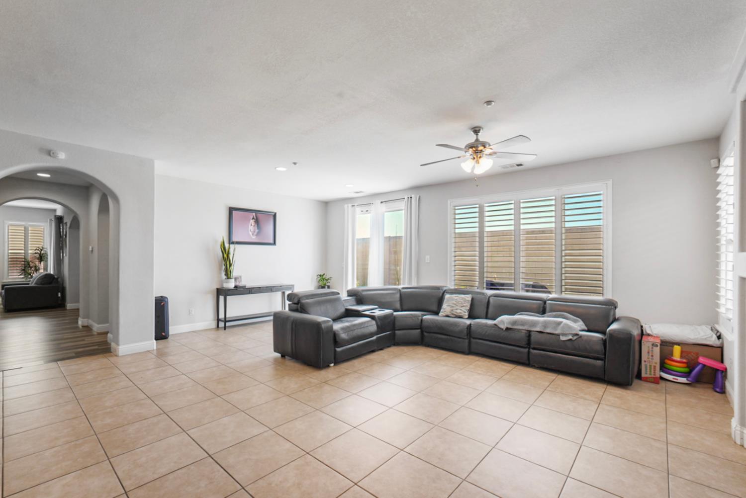 16501 Upper Pasture Lathrop, CA 95330 - Photo 5 of 41 a living room with furniture and a large window