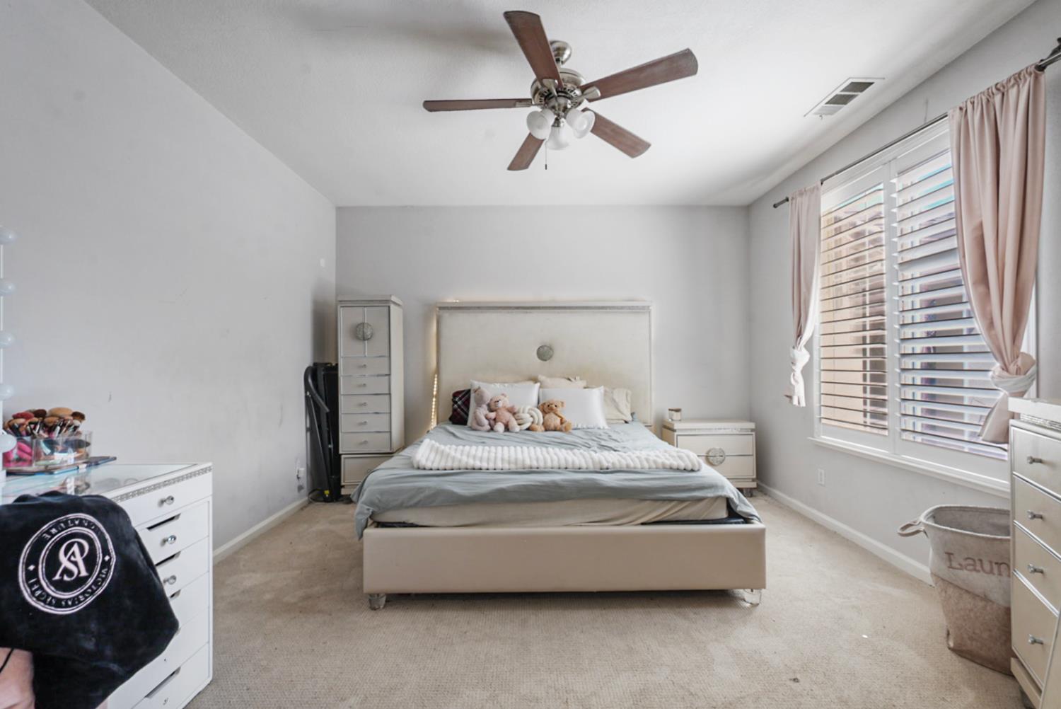 16501 Upper Pasture Lathrop, CA 95330 - Photo 6 of 41 a bedroom with a bed and a dresser