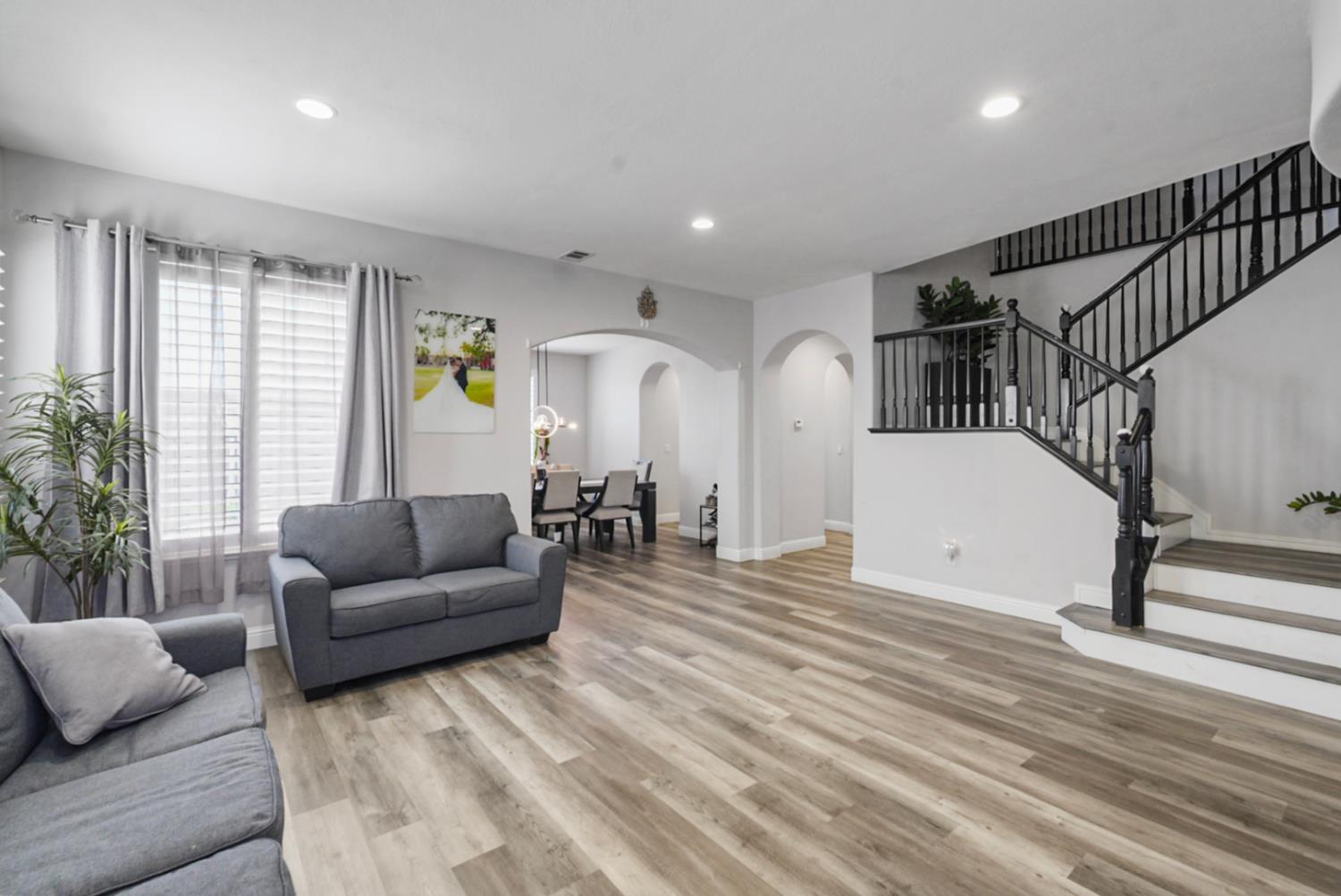 16501 Upper Pasture Lathrop, CA 95330 - Photo 8 of 41 a living room with furniture and wooden floor