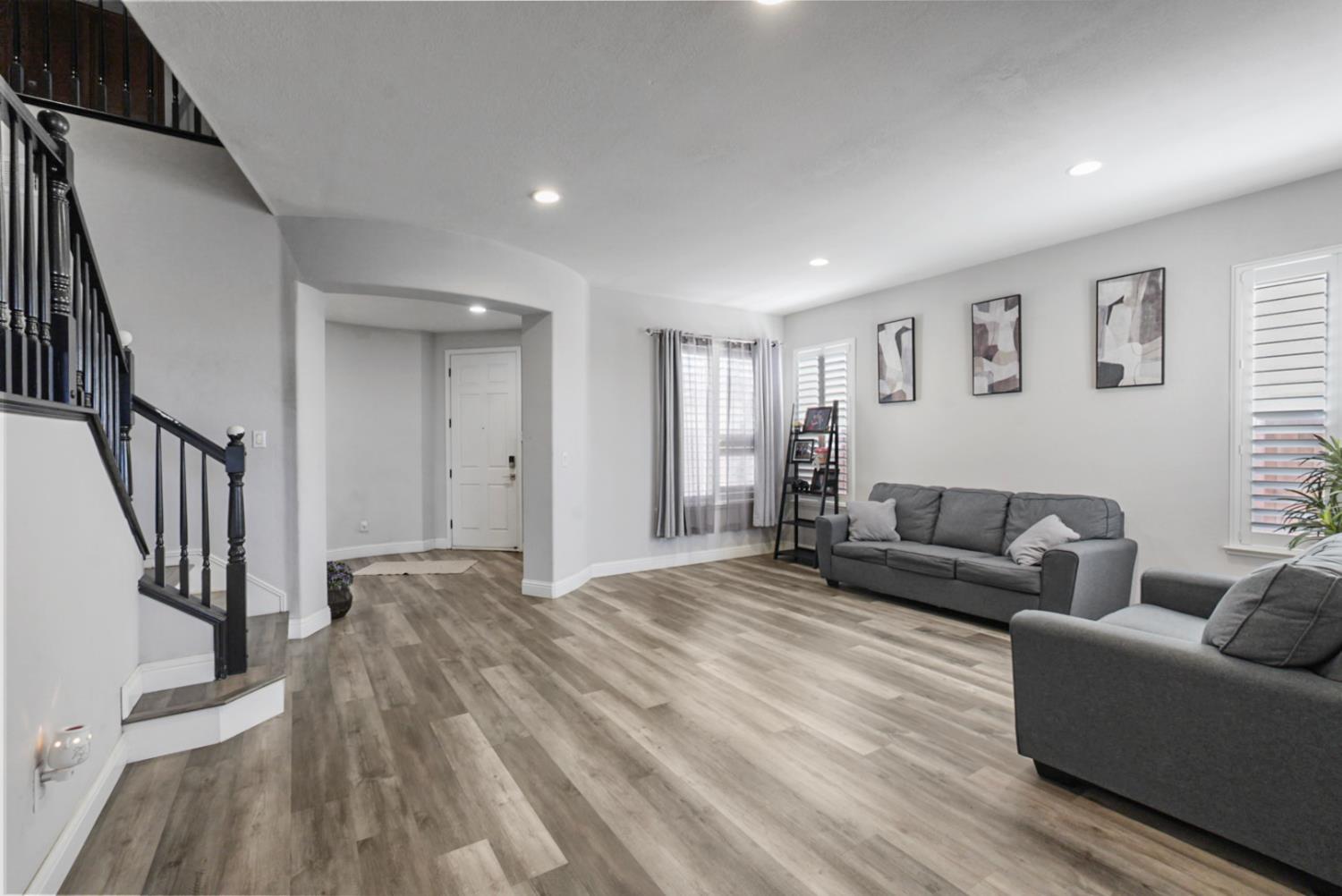 16501 Upper Pasture Lathrop, CA 95330 - Photo 9 of 41 a living room with furniture and a wooden floor