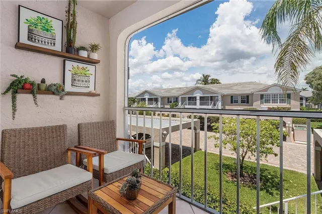 a view of balcony with furniture
