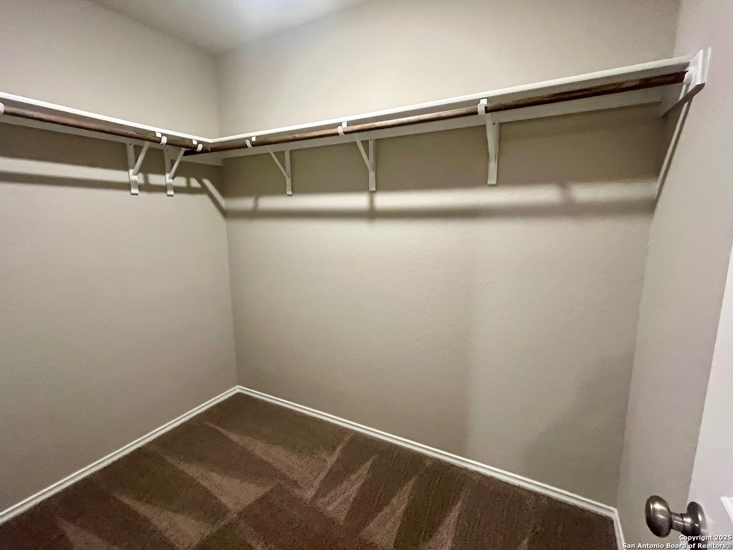 10418 Midsummer Meadow Converse, TX 78109 - Photo 14 of 24 a view of a room with racks on the wall