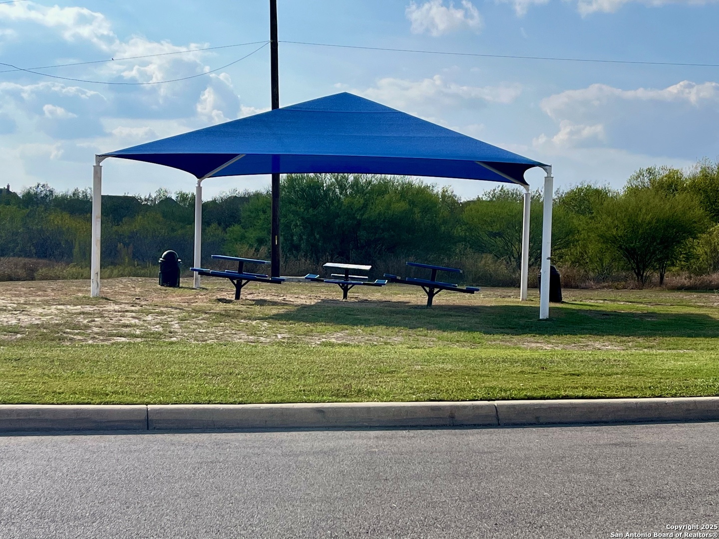 10418 Midsummer Meadow Converse, TX 78109 - Photo 24 of 24 a view of a table and chairs under an umbrella