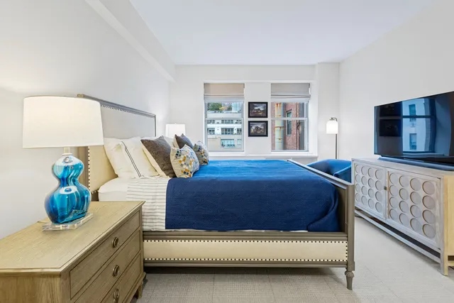 a bedroom with a bed and a couch