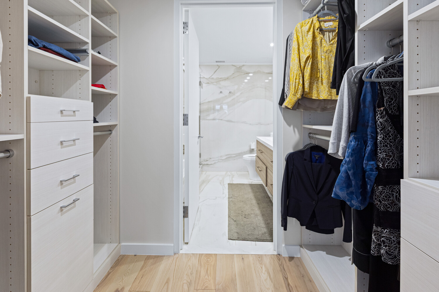 27 West 19th Street, Unit 12 Manhattan, NY 10011 - Photo 11 of 18 a view of walk in closet with clothes and shoes