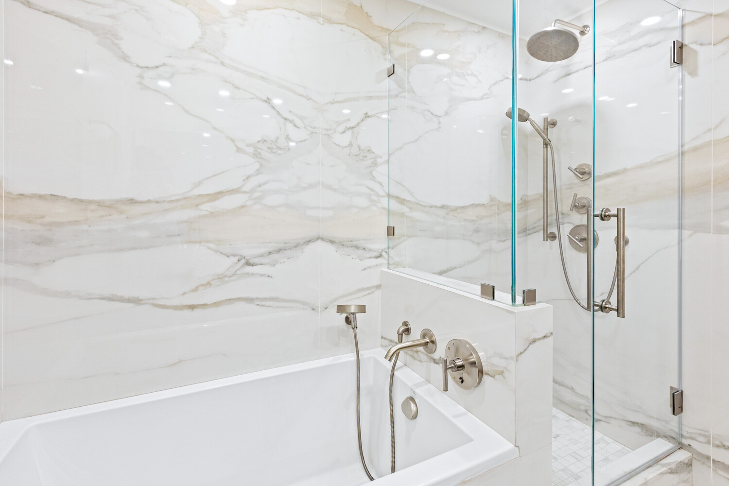 27 West 19th Street, Unit 12 Manhattan, NY 10011 - Photo 13 of 18 a bathroom with a bathtub and shower