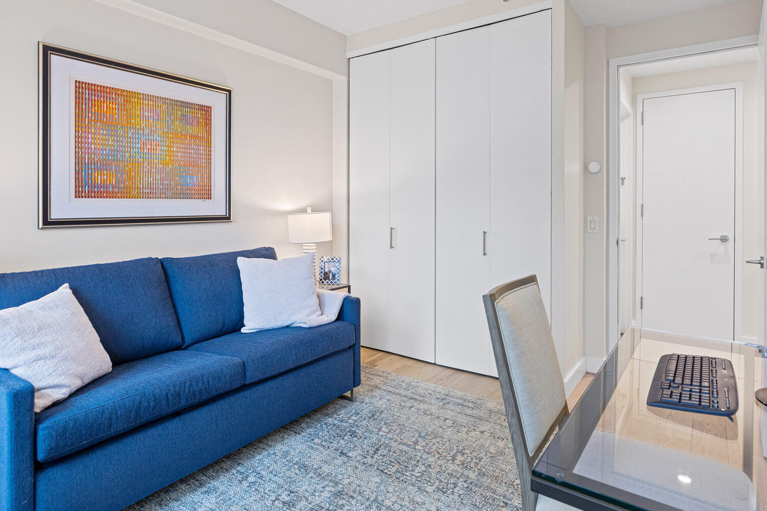 27 West 19th Street, Unit 12 Manhattan, NY 10011 - Photo 15 of 18 a living room with furniture and a window