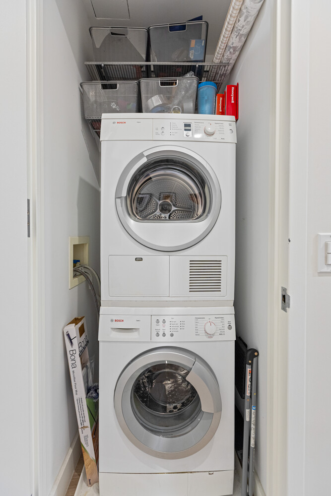 27 West 19th Street, Unit 12 Manhattan, NY 10011 - Photo 17 of 18 a utility room with dryer and washer