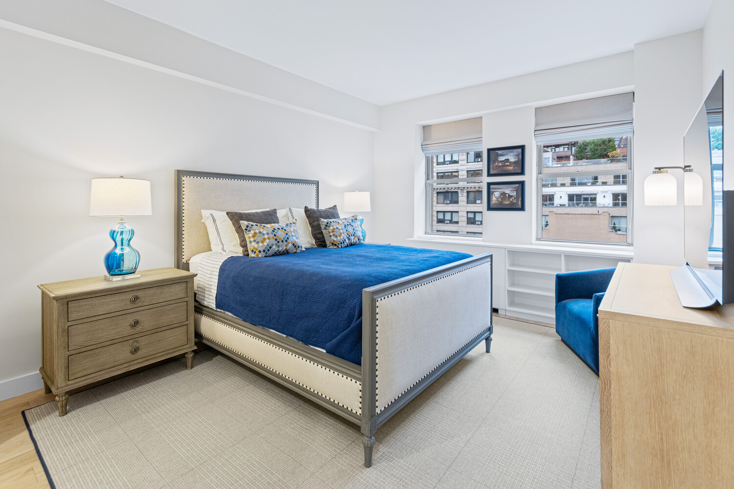 27 West 19th Street, Unit 12 Manhattan, NY 10011 - Photo 9 of 18 a bed room with a bed and a desk