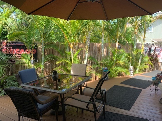192 Eggerking Road Kapaa, HI 96746 - Photo 3 of 3 a view of an outdoor sitting area with furniture and umbrella