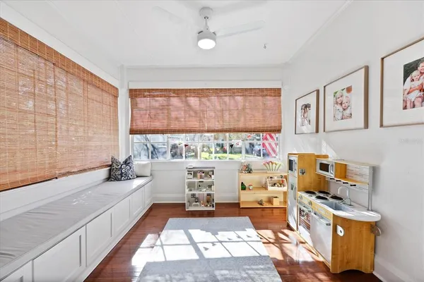 a view of a dining room with furniture window and wooden floor