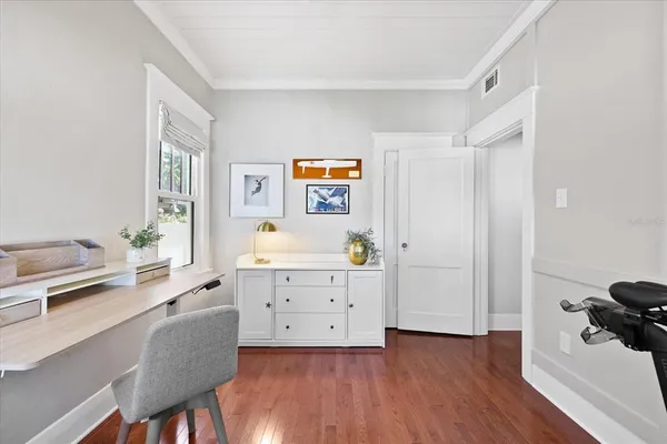 a bathroom with a granite countertop sink double vanity and a mirror