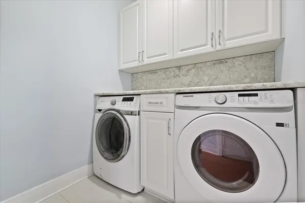 a bedroom with a bed couch and window