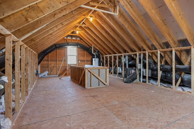 a view of an empty room with wooden walls