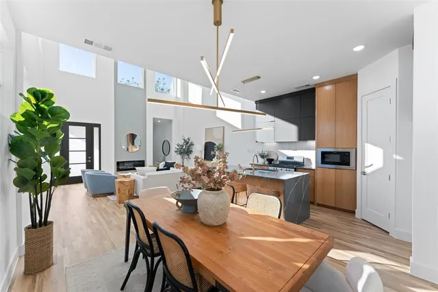 a kitchen with a table and chairs