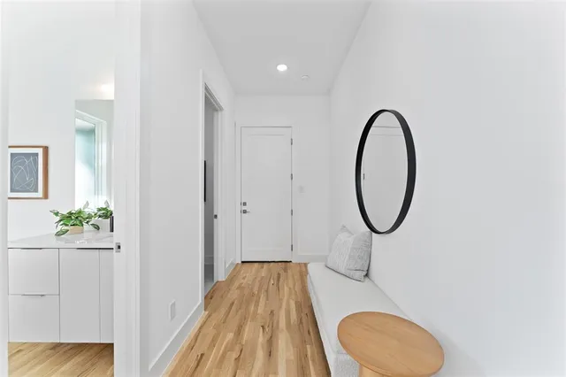 a view of a bathroom with a sink and a mirror