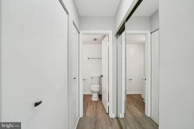 a view of a bathroom from a hallway