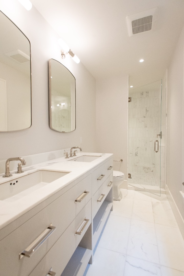 10 Silver Street Nantucket, MA 02554 - Photo 37 of 48 a bathroom with a tub a sink and mirror