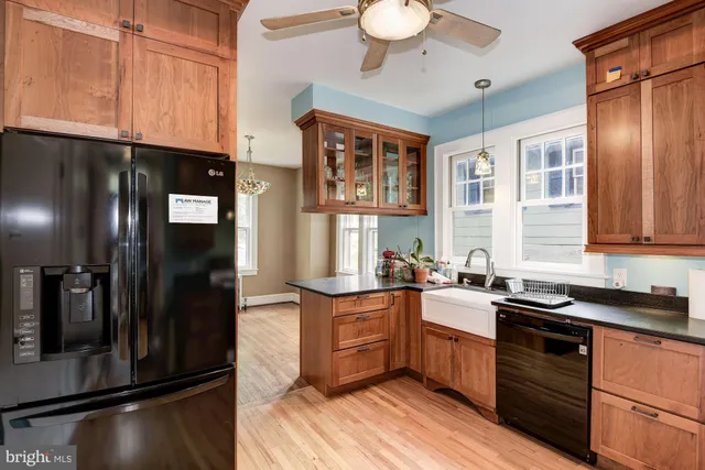 a kitchen with stainless steel appliances a sink stove and refrigerator