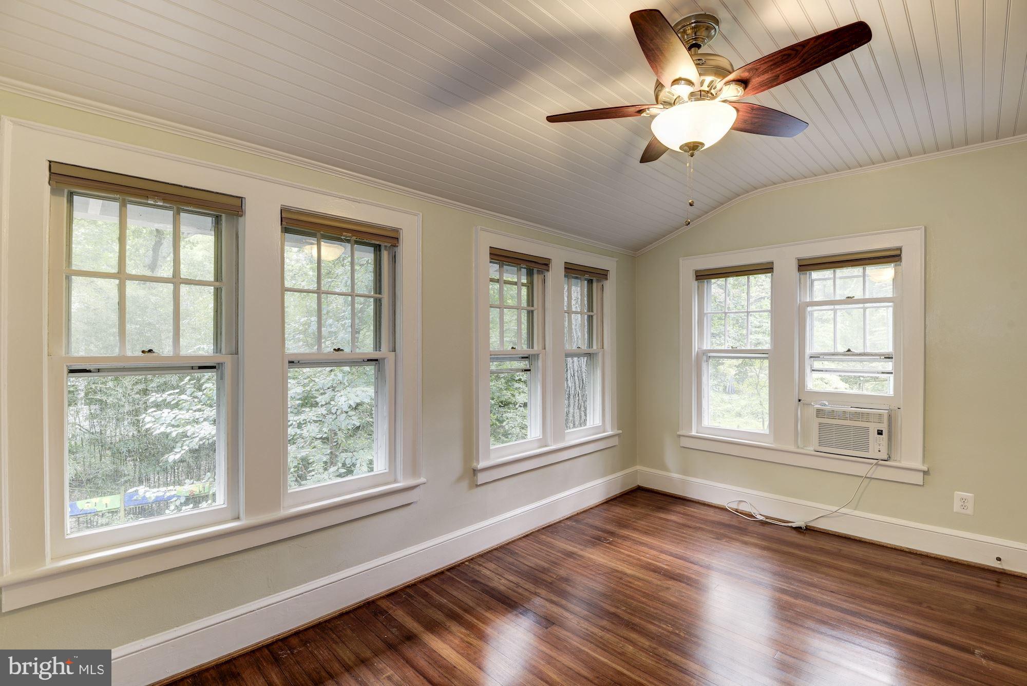 7413 Maple Avenue Takoma Park, MD 20912 - Photo 15 of 30 a view of an empty room with wooden floor and a window