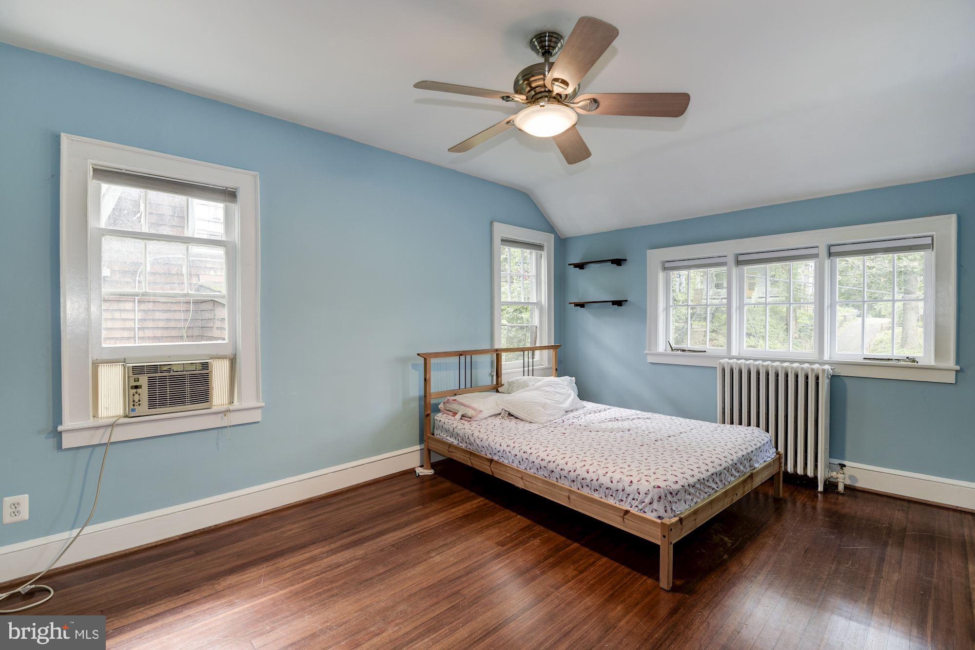 7413 Maple Avenue Takoma Park, MD 20912 - Photo 19 of 30 a bedroom with a bed and a window
