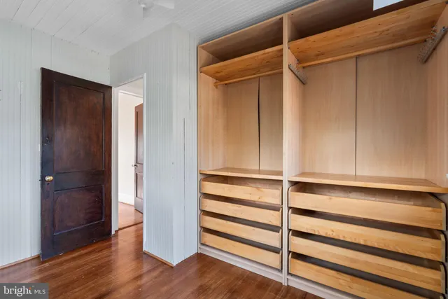 a view of closet area with empty racks