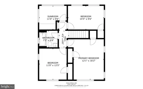 a picture of a bench in front of a wall