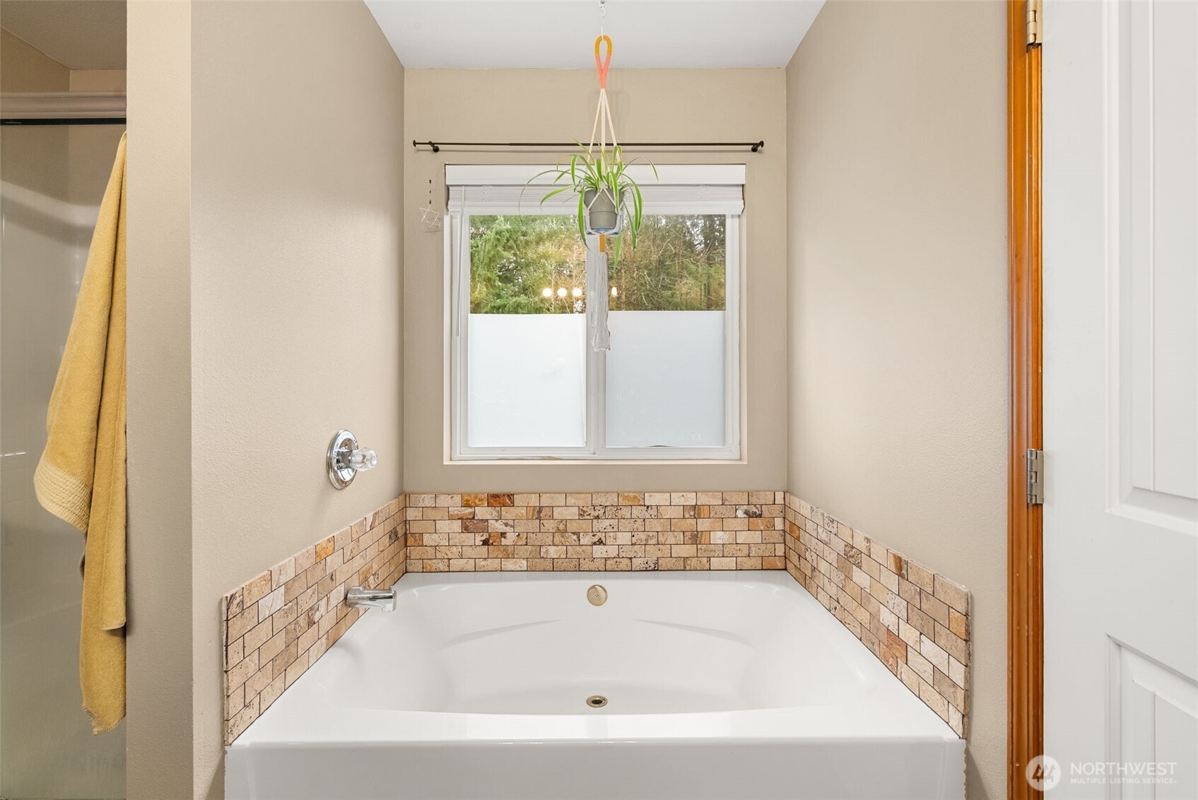 3426 Lady Fern Loop Northwest Olympia, WA 98502 - Photo 21 of 34 a bathroom with a bathtub and window