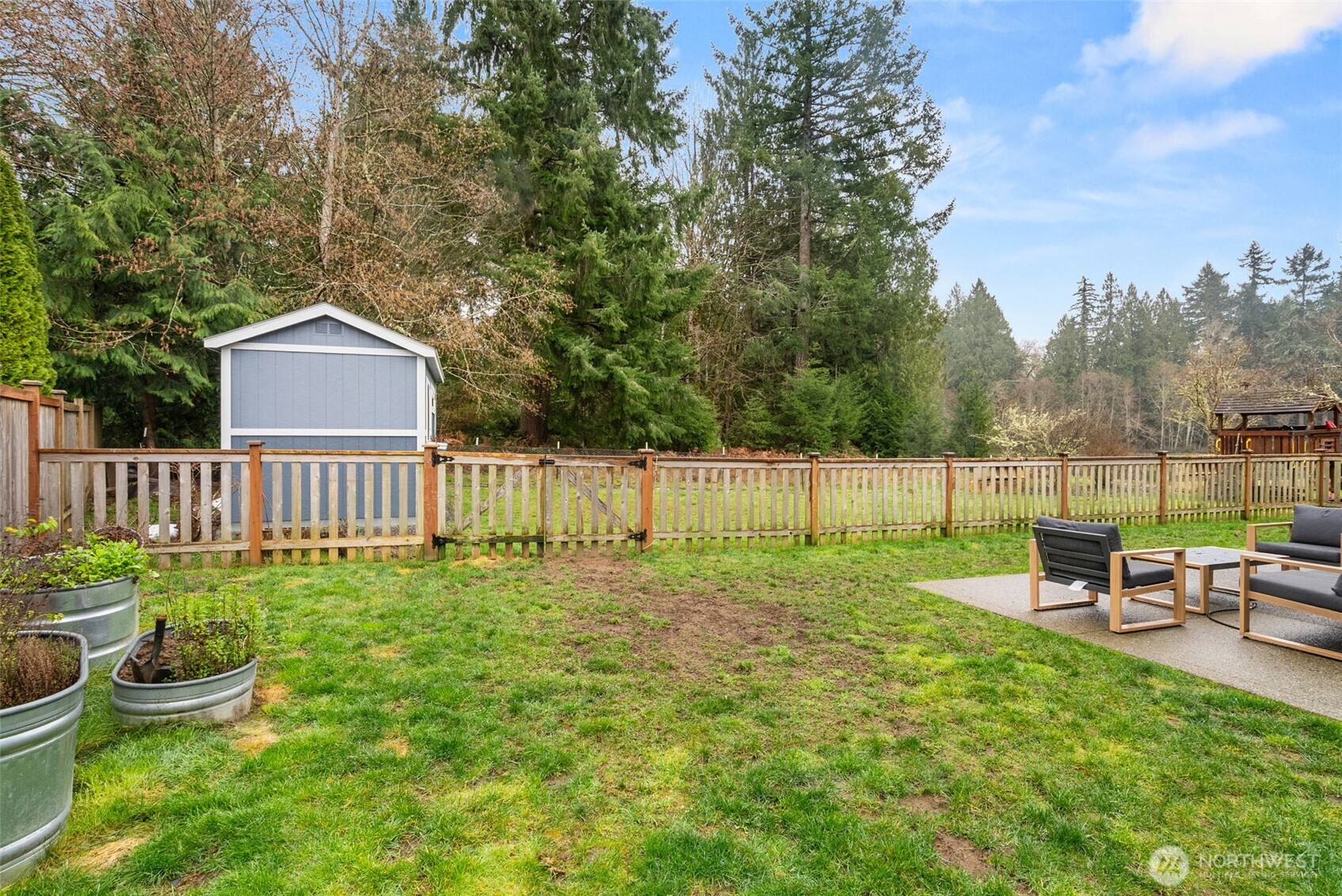 3426 Lady Fern Loop Northwest Olympia, WA 98502 - Photo 28 of 34 a view of a chair and table in the garden