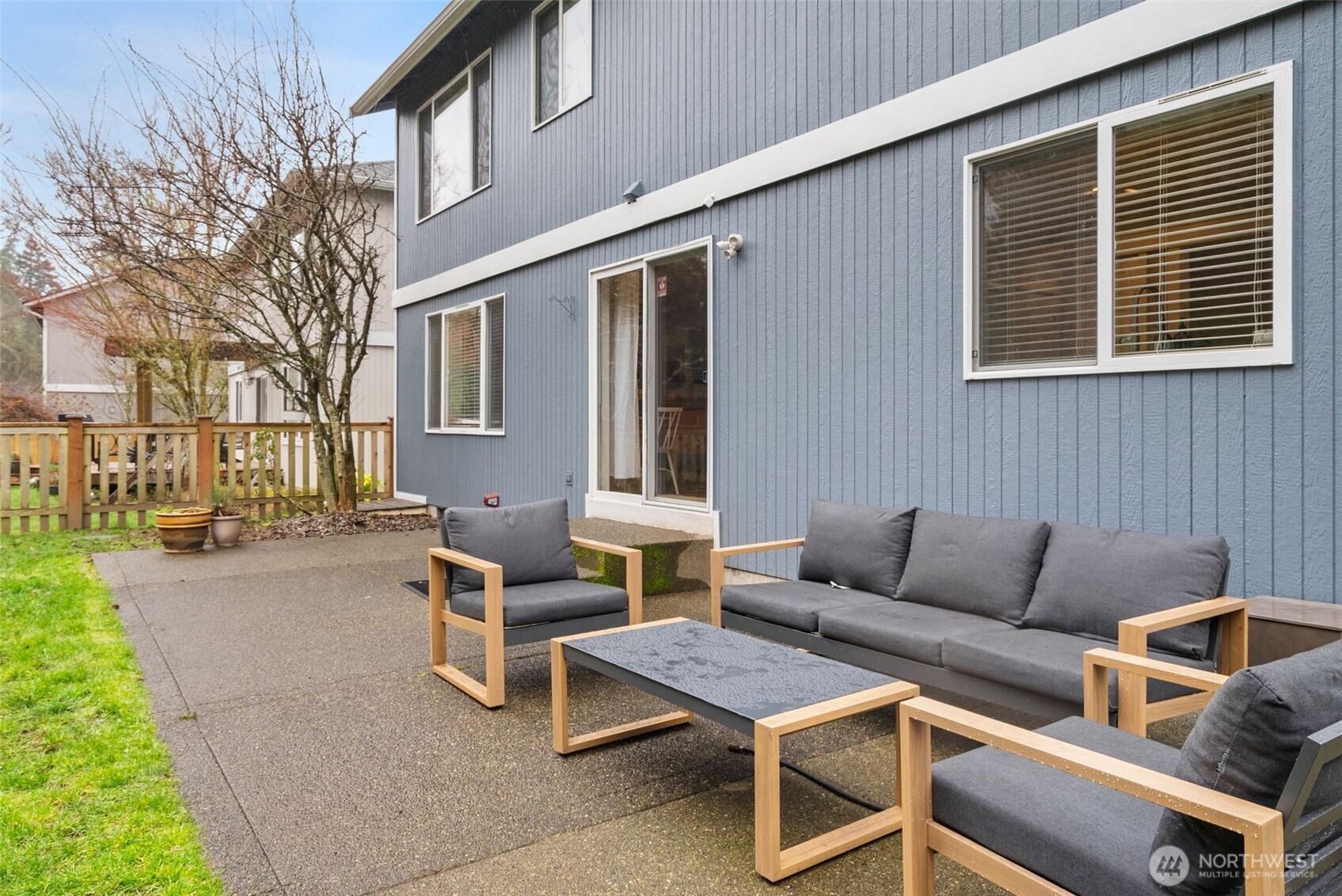 3426 Lady Fern Loop Northwest Olympia, WA 98502 - Photo 30 of 34 a view of a patio with couches table and chairs and potted plants