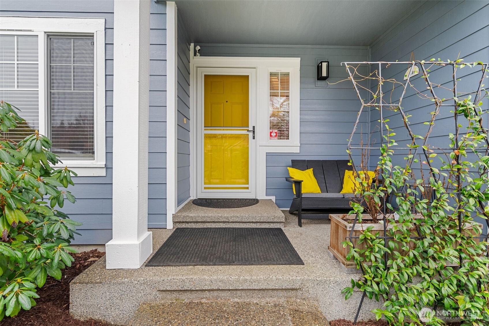 3426 Lady Fern Loop Northwest Olympia, WA 98502 - Photo 3 of 34 a view of entryway door with potted plants