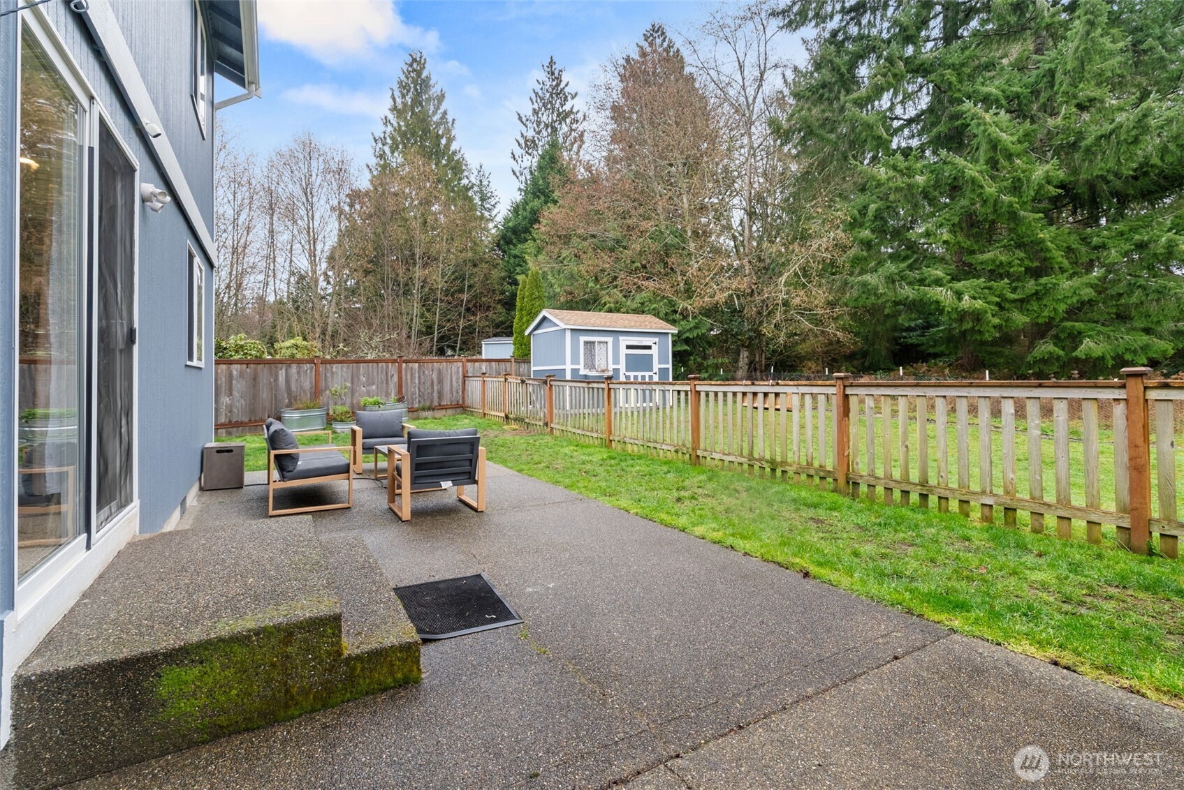 3426 Lady Fern Loop Northwest Olympia, WA 98502 - Photo 31 of 34 a view of a two chairs in the back yard of the house
