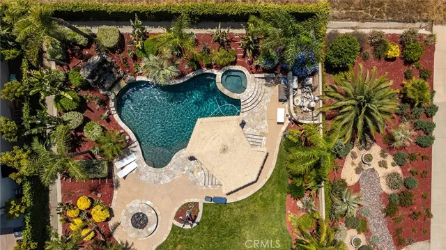 an aerial view of a swimming pool and outdoor space