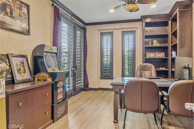 a living room with a couch and a ceiling fan