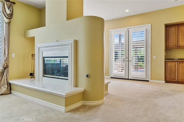 a bedroom with two beds and painted window