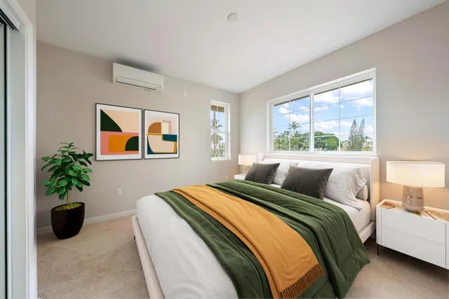 a bedroom with a balcony a bed and a potted plant