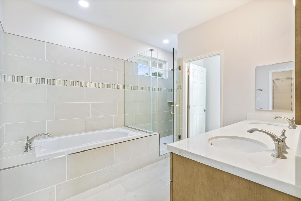75-3744 Leialii Loop Kailua-Kona, HI 96740 - Photo 5 of 10 a bathroom with a granite countertop sink a toilet and shower