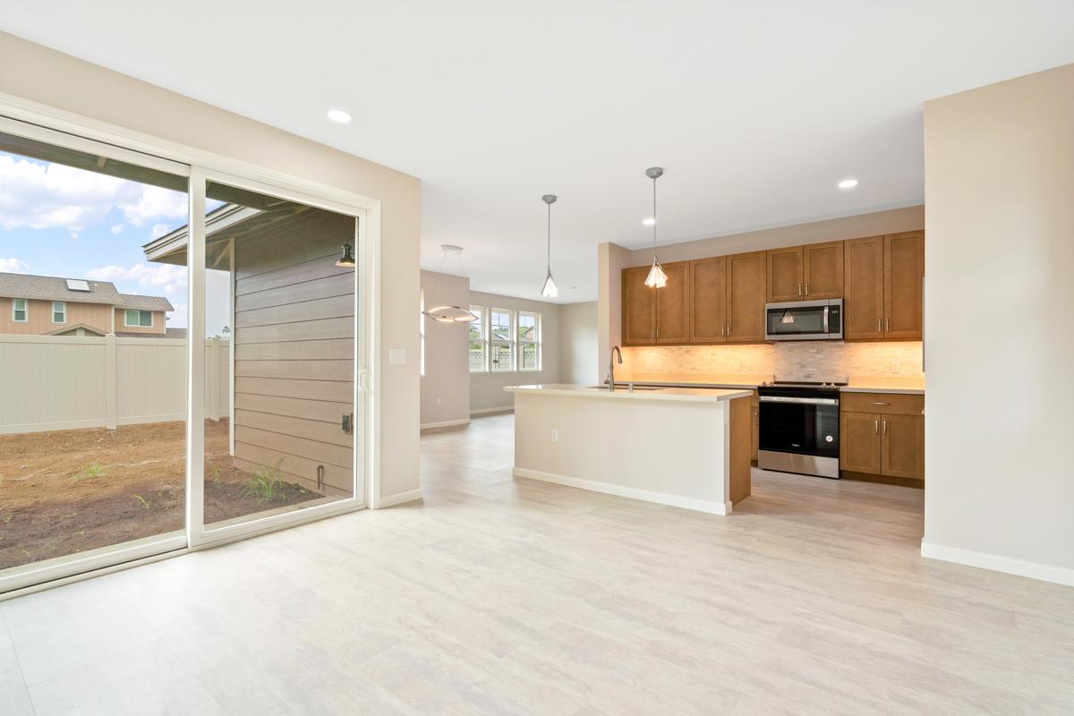 75-3744 Leialii Loop Kailua-Kona, HI 96740 - Photo 8 of 10 a large white kitchen with a stove a refrigerator and a sink