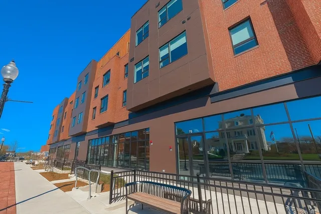 a view of building with glass door